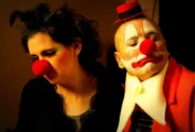 Man and woman in costumes of clowns
